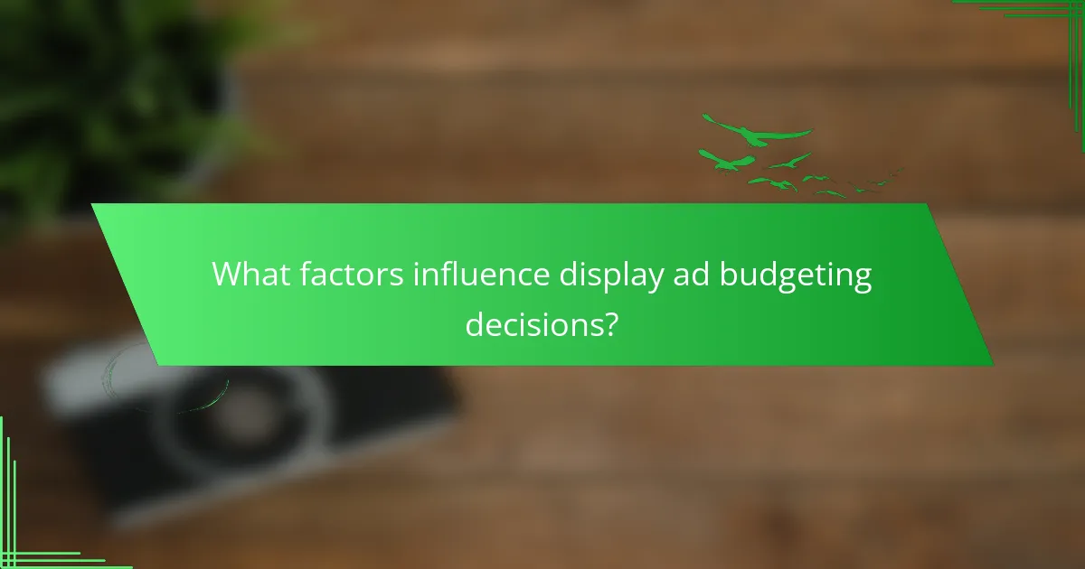 What factors influence display ad budgeting decisions?